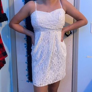 a short, white, sparkly dress
